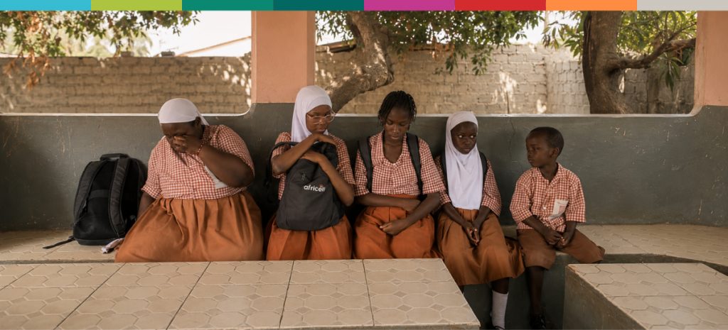 Schoolchildren Waiting in a Shaded Courtyard